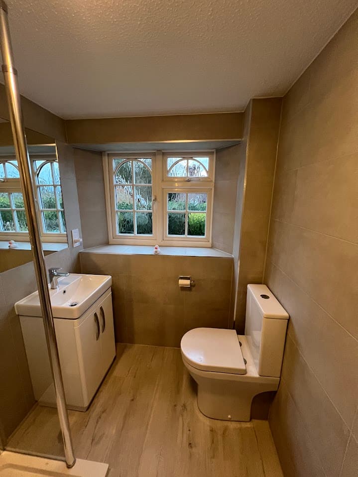 Sandstone & Mosaic Shower Room