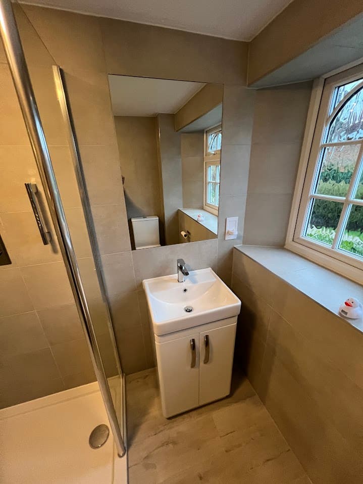 Sandstone & Mosaic Shower Room detail