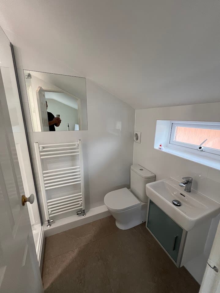 Clean White Loft Shower Room